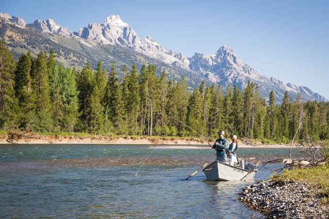 Guided fly fishing on the Snake River with the Grand Tetons in the background