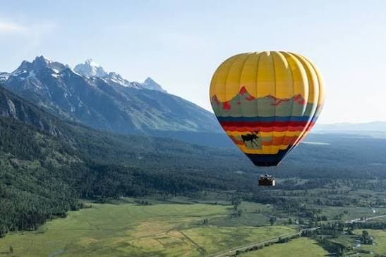 Hot air balloon above Jackson Hole with Grand Teton views