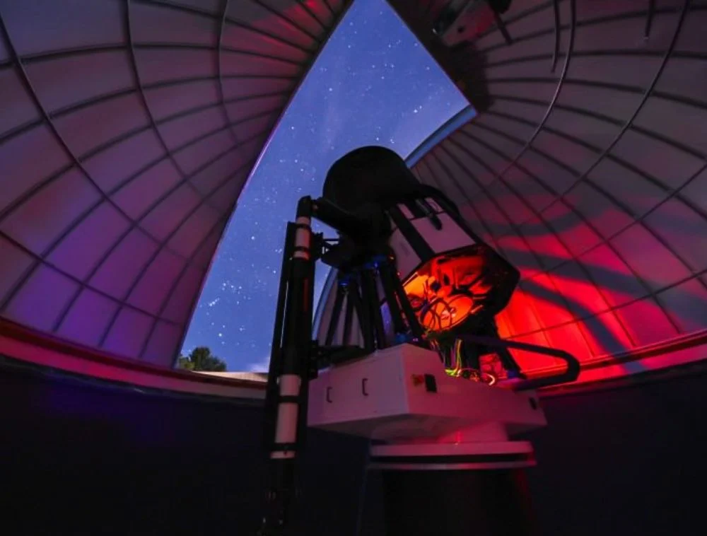 Observatory telescope pointed at the Teton night sky